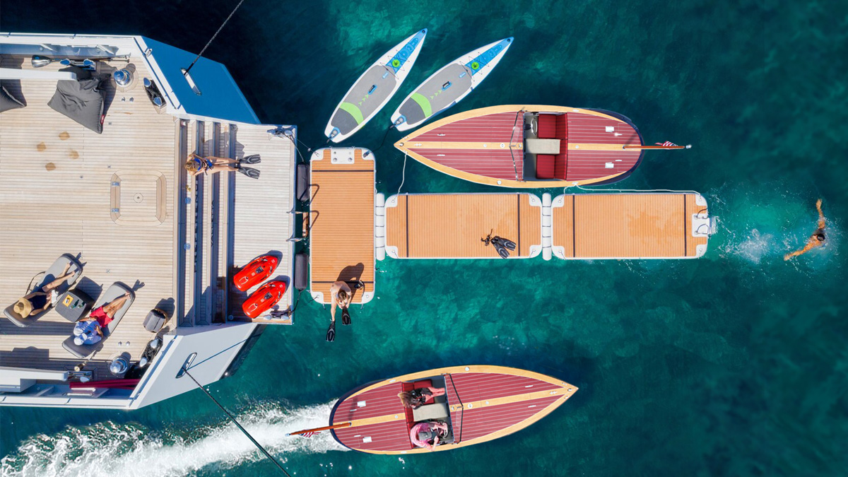 photo of Reward with Nautibuoy floating docks behind yacht